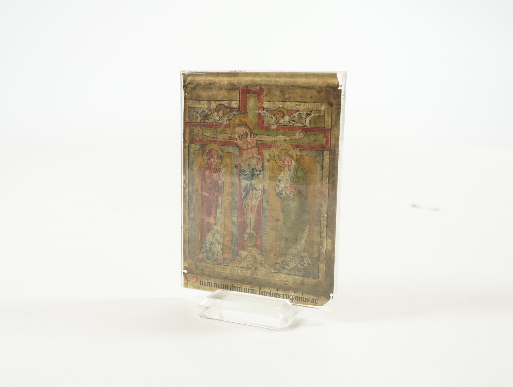 An illuminated leaf from a missal at the Canon, with Crucifixion scene, the reverse inscribed with the Te igitur, probably Austria or South German, second half 12th century